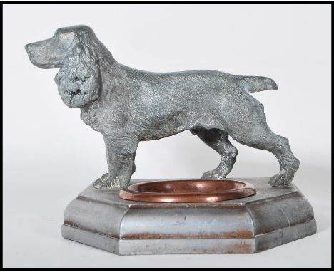 A vintage mid 20th Century trinket dish / ashtray having a copper bowl within a stepped five sided base having a cast metal f
