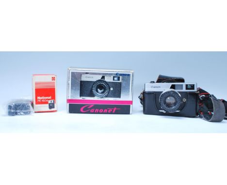 A vintage 20th century Canon ' Canonet ' SLR camera complete in the original box together with accessory