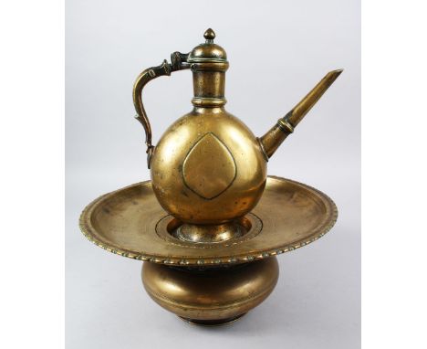 AN 18TH CENTURY MUGHAL INDIAN BRASS EWER &amp; BASIN, the ewer 27cm high x 26cm wide. the basin 15cm high x 33cm diameter.