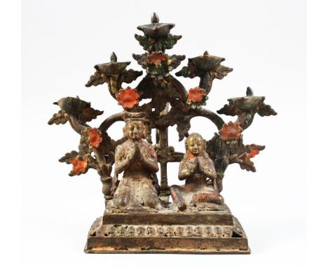 A FINE 18TH / 19TH CENTURY INDIAN OR NEPALESE BRONZE OIL LAMP, of a seated couple with five oil trays, 20.5 cm high x 20.5cm 