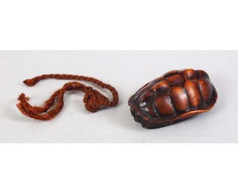 A JAPANESE MEIJI PERIOD CARVED WOODEN NETSUKE OF A TURTLE, the turtle well detailed, himotoshi formed to the centre with a re