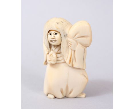 A GOOD JAPANESE MEIJI PERIOD CARVED IVORY NETSUKE OF KARAKURI, the netuske with a rotating face with two faces, artist signed