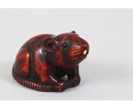 A JAPANESE LATE EDO PERIOD CARVED WOODEN NETSUKE OF A RAT, In the style of Masanao, the rat in a seated position with its tai