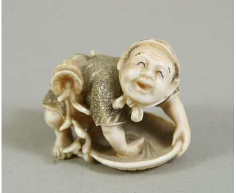 A JAPANESE MEIJI PERIOD CARVED IVORY NETSUKE OF A MAN, the man leant over his pan working, with a basket of spilling flora to