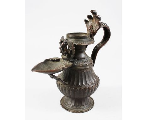 A FINE QUALITY 17TH / 198TH CENTURY NEPALESE BRONZE OIL LAMP, 21.5cm high x 20.5cm wide.