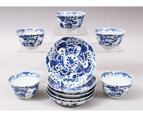 A SET OF 5 KANGXI PERIOD CHINESE BLUE &amp; WHITE PORCELAIN TEA CUP &amp; SAUCERS, the body with landscape and flora decorati