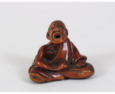 A JAPANESE EDO PERIOD CARVED BOXWOOD NETSUKE OF A SCRATCHER MAN, the man in a seated position with his head slightly aloft, w