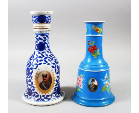 TWO QAJAR CERAMIC HUQQA BASES, both with oval portraits, 26cm and 23cm high.