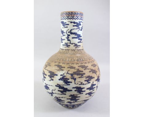 A LARGE 19TH / 20TH CENTURY CHINESE BLUE &amp; WHITE PORCELAIN BOTTLE VASE, enamel decorated with stylized clouds, the base b