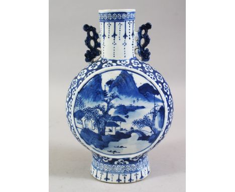 A GOOD 19TH CENTURY CHINESE BLUE &amp; WHITE TWIN HANDLE PORCELAIN MOON FLASK, with two circular panels depicting landscape s