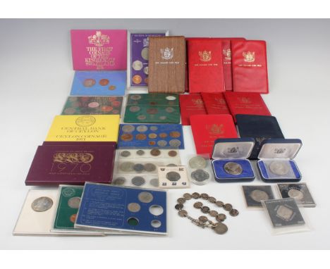 A collection of Royal Mint and other year-type sets and other commemorative coins, including two New Zealand dollars, 1974 an