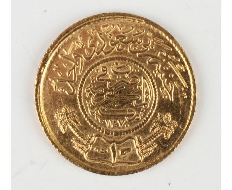 A Saudi Arabia gold sovereign.Buyer’s Premium 29.4% (including VAT @ 20%) of the hammer price. Lots purchased online via the-