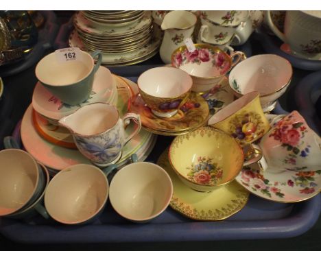 A Tray of Tea Cups and Saucers Including Aynsley Orchard Gold.