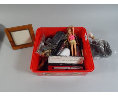 A Box of Curios to Include Alarm Clock Harmonicas Coins Pens Etc. 