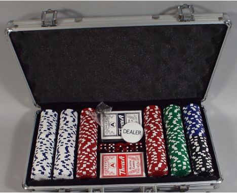 A Metal Case Containing Gambling Chips Playing Cards Die Etc.