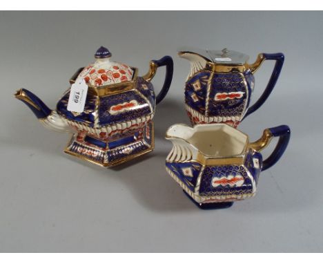 An Allertons Three Piece Tea Set with Teapot Stand. 