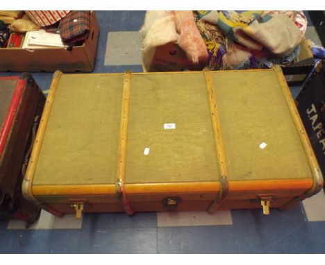 A Wood and Canvas Travelling Trunk.