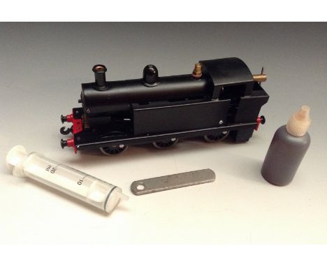 A Burton Leech O gauge Live Steam 0-6-0T Tank locomotive, black livery, as new unfired,with original and box comprising fuel,