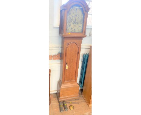 A George III Oak cased Longcase Clock. Circa 1800. The silver dial tarnished. With a key pendulum and two weights