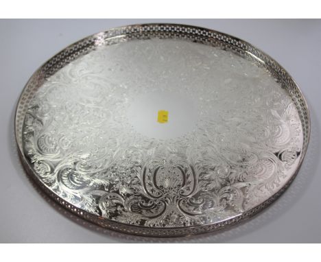 A Round Silver Plated Tray with Pierced Gallery and Decorated to Base 