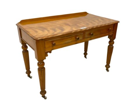 Victorian satinwood side table, raised back over rectangular top with moulded edge, fitted with two drawers over c-scroll bra