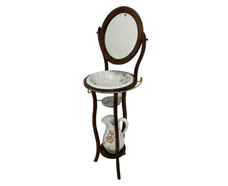 Georgian design shaving washstand, circular swing mirror over bowl rests with brass towel rail, waived supports united by und
