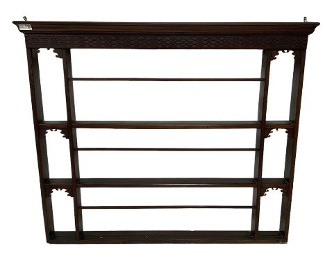 Georgian Chippendale design mahogany plate rack, projecting cornice over blind fretwork frieze, three-tier rack with moulded 