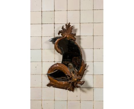 Full title: A moon-shaped mirror in a basswooden 'dragon' frame in the style of Viardot, 19/20th C.Description:68 x 40,5 cmAb