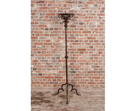 Full title: A large wrought iron candlestick, 19th C.Description:H 148,5 cm