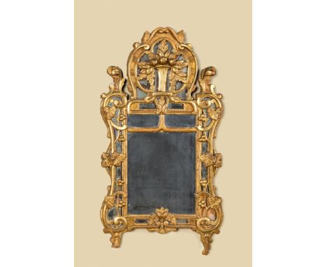 Full title: A gilt wooden mirror with floral design, 18th C.Description:92 x 49,5 cmAbout this sale: Paul De Grande is one of