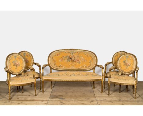 Full title: A French five-piece gilt wooden salon set comprising a sofa and four armchairs with embroidered upholstery, 19th 