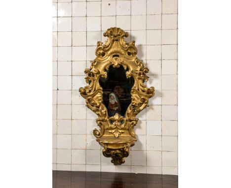 Full title: A large French gilt wooden console mirror, 18th C.Description:118,5 x 66 cmAbout this sale: Paul De Grande is one