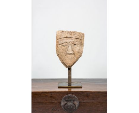 Full title: A large carved stone head of a winking man, 15th C. or laterDescription:H 38 cm (without stand)About this sale: P