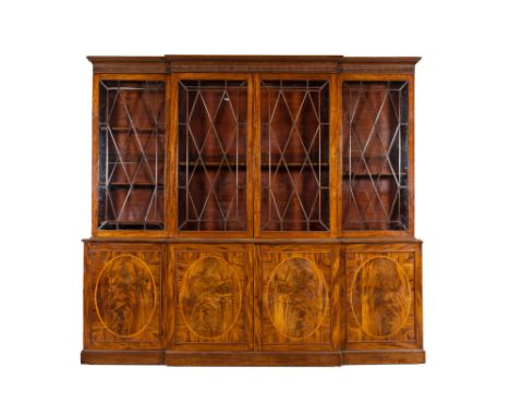 Full title: A large English magohany four-door break fronted library bookcase, 19th C.Description:H 276,5 x L 308 x D 60 cmAb