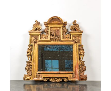 Full title: An architecturally carved and gilt wooden mirror with putti, 18/19th C.Description:77 x 73 cmAbout this sale: Pau