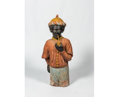Full title: A French polychrome terracotta fireplace in the shape of a pipe smoking Moor, ca. 1900Description:H 106,5 cmAbout