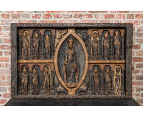 Full title: A Spanish polychrome wooden panel depicting Jesus in a medallion surrounded by the twelve apostles after the alta