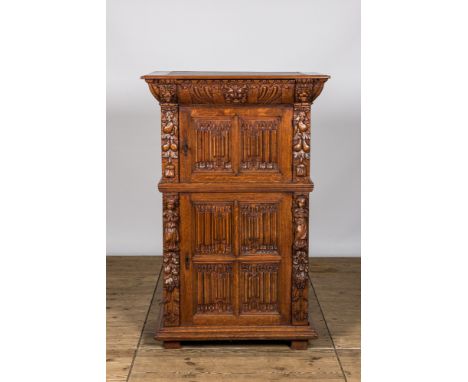 Full title: A Gothic Revival oak two-door cupboard with linenfold panels, 19th C. with older elementsDescription:H 138,5 x L 