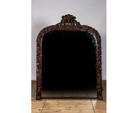 Full title: A richly sculpted oak wooden mirror, 19th C.Description:H 192 x L 149 cmAbout this sale: Paul De Grande is one of