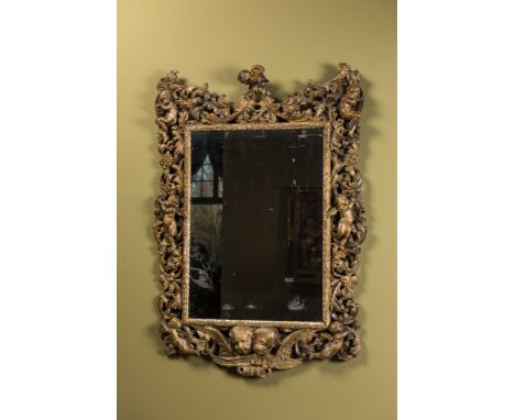 Full title: A finely carved polychromed wooden mirror with putti, Italy, 17th C.Description:102,5 x 73 cmAbout this sale: Pau