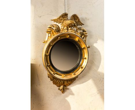 Full title: A gilt wooden eagle-topped butler mirror with ebonised border, ca. 1900Description:H 76 cm x W 45 cmAbout this sa