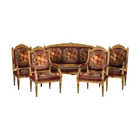 Full title: A neoclassical gilt wooden salon set comprising a sofa and four armchairs, 20th C.Description:H 106,5 x L 163,5 x