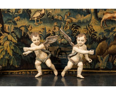 Full title: A pair of large polychrome wooden winged cherubs, 19th C.Description:H 63,5 cmAbout this sale: Paul De Grande is 