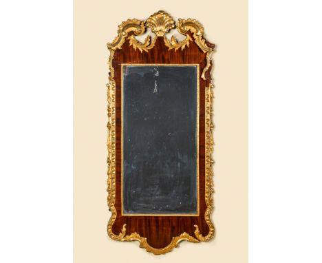 Full title: A large partly gilded mahogany veneered wooden Louis XV-style mirror, 19/20th C.Description:152 x 69 cmAbout this