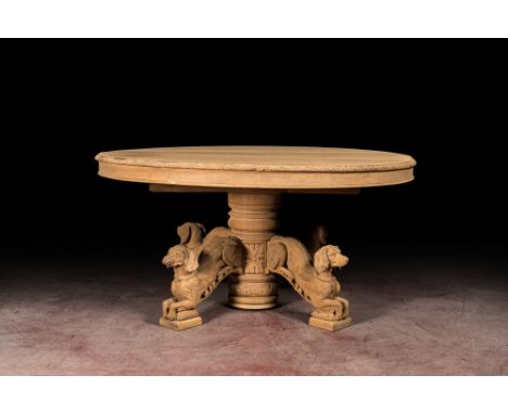 Full title: A bleached oak wooden oval table on a richly carved central base with dogs, 19th C.Description:H 75 x Dia 150,5 c