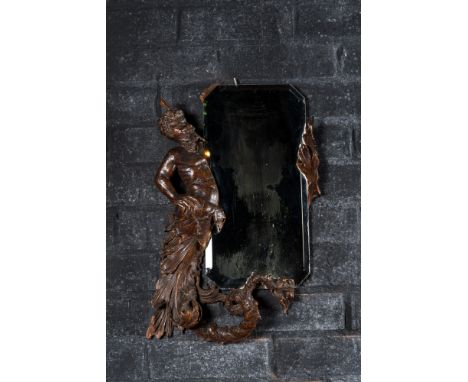 Full title: A mirror in a basswooden 'water faunn' frame, 19th C.Description:63 x 39,5 cmAbout this sale: Paul De Grande is o