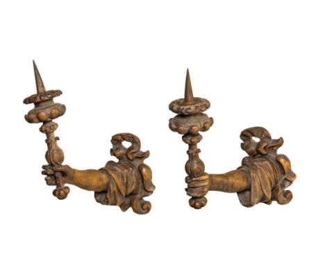 Full title: A pair of German patinated basswood wall appliques in the shape of a hand with a candlestick, 19th C.Description: