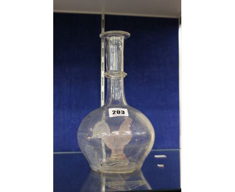 A 'cockerel' glass decanter, with inner model of a cockerel, 25cm high