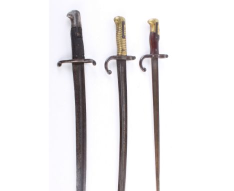 A French Model 1874 Gras Bayonet of standard production specification, the blade typically inscribed to its back edge and dat