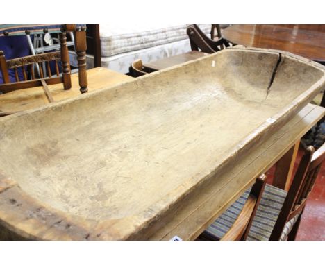 A carved 'dug-out' trough, 160cm long.Property of the owners of the Downton Estate, Shropshire